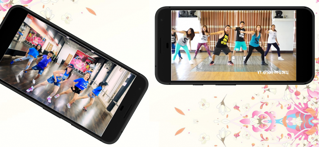 Dois celulares mostrando videoaulas do Aplicativo Treino Aeróbico para Zumba, cada uma com um grupo de pessoas dançando Zumba