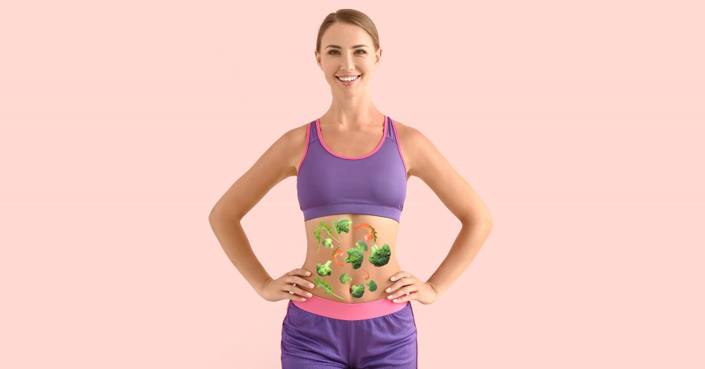 Foto conceito de mulher com imagens de legumes sobre a barriga