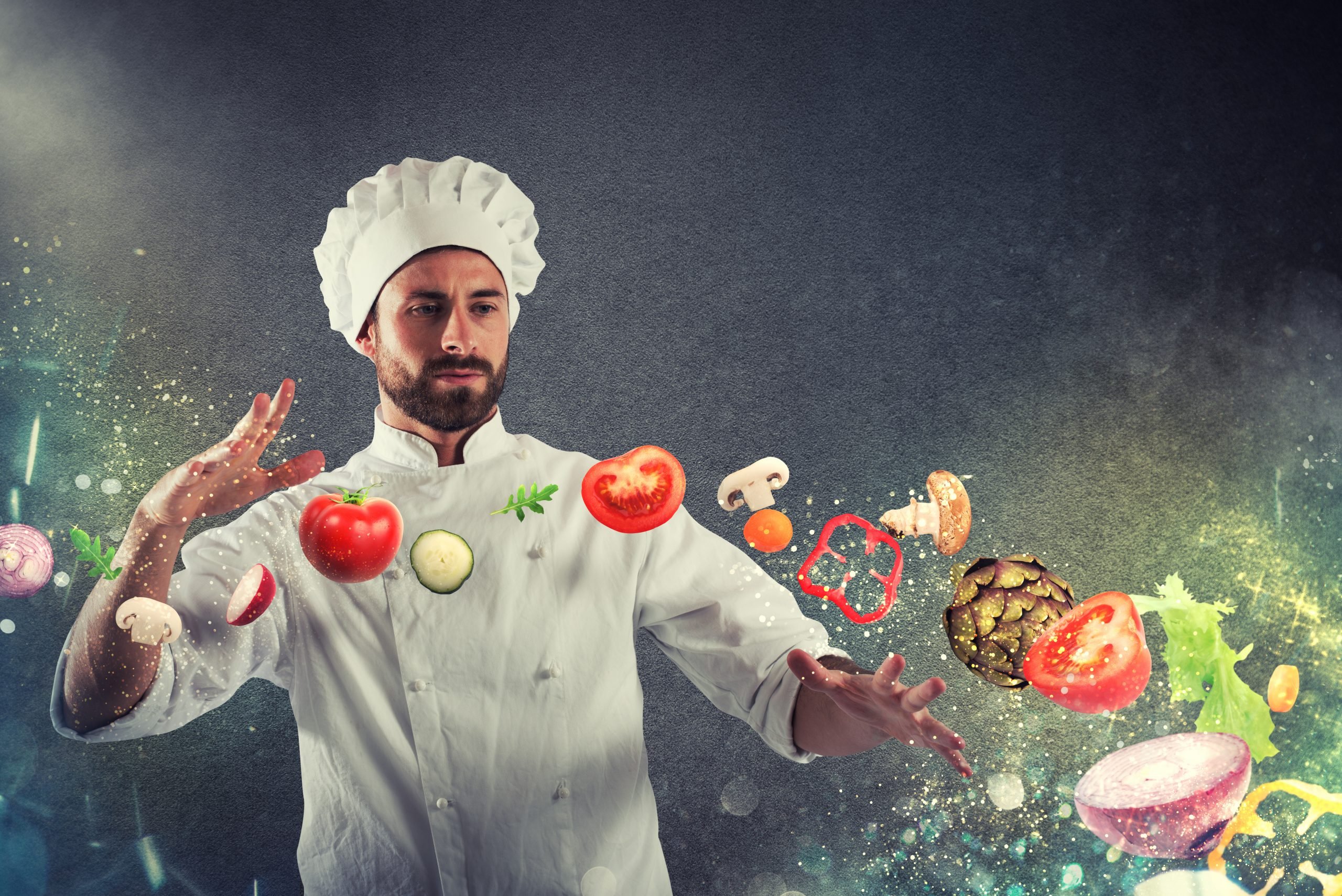 Chef de cozinha olhando para a frente com ingredientes voando