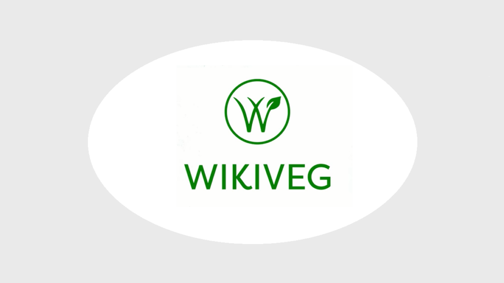 Logotipo Wikiveg dentro de círculo oval branco com fundo cinza